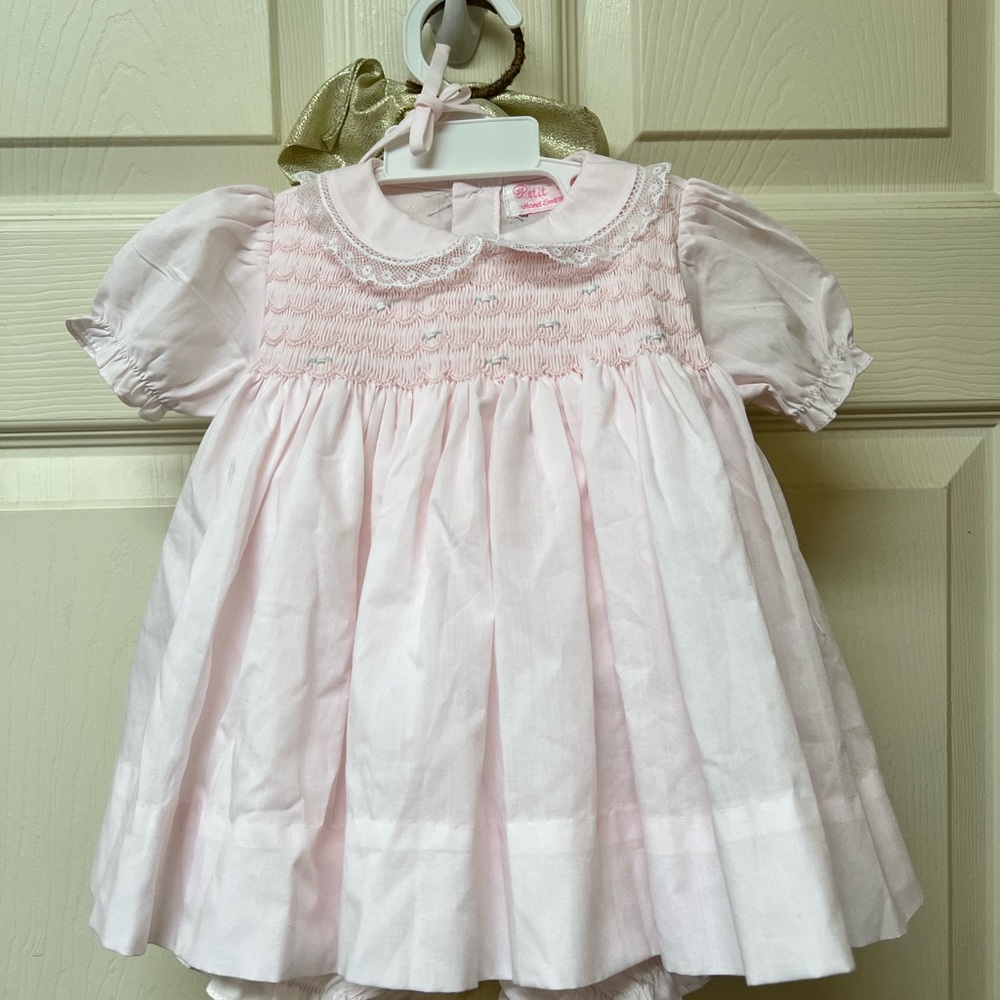 Worn once. Good as new. Light pink dress for newborn.